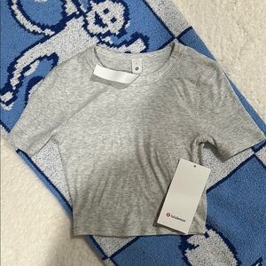 Lululemon “Hold Tight” Straight Hem Cropped Grey T-Shirt